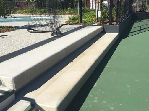 Best Landscape Feature Commercial Highly Commended - Eureka Landscapes - Forest Green Tennis Court Walls & Seating - Pimpama